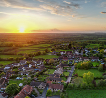 English Village and Countryside from above at sunset