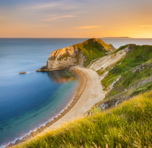 Jurassic Coast Beach pictured from cliffside at sunset